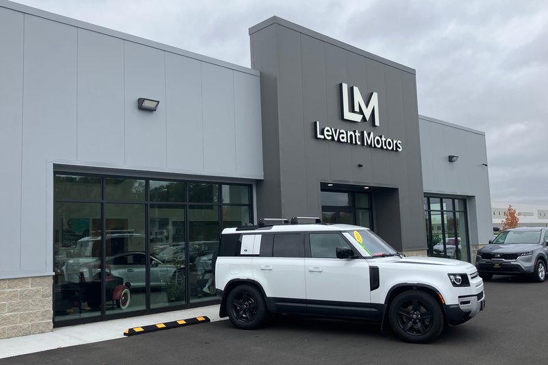 The dealership facade and corner showroom windows