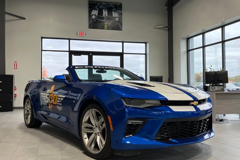 Blue convertible photographed inside the Levant Motors showroom