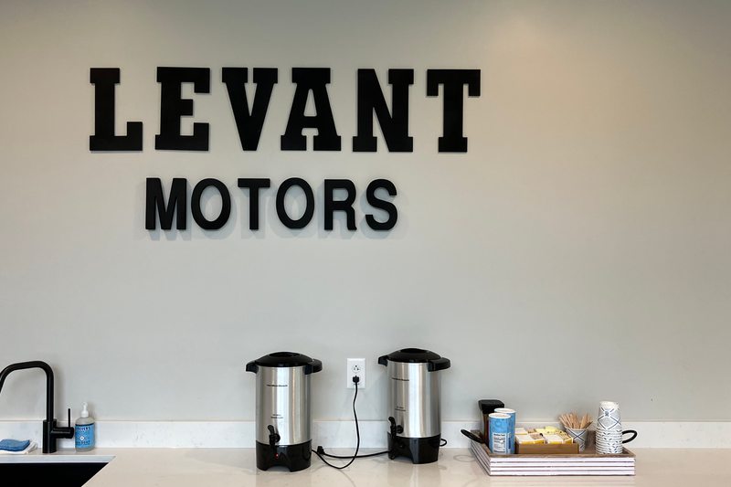 The refreshment counter beneath the Levant Motors wall sign
