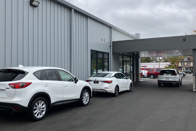 The covered drive beside the dealership