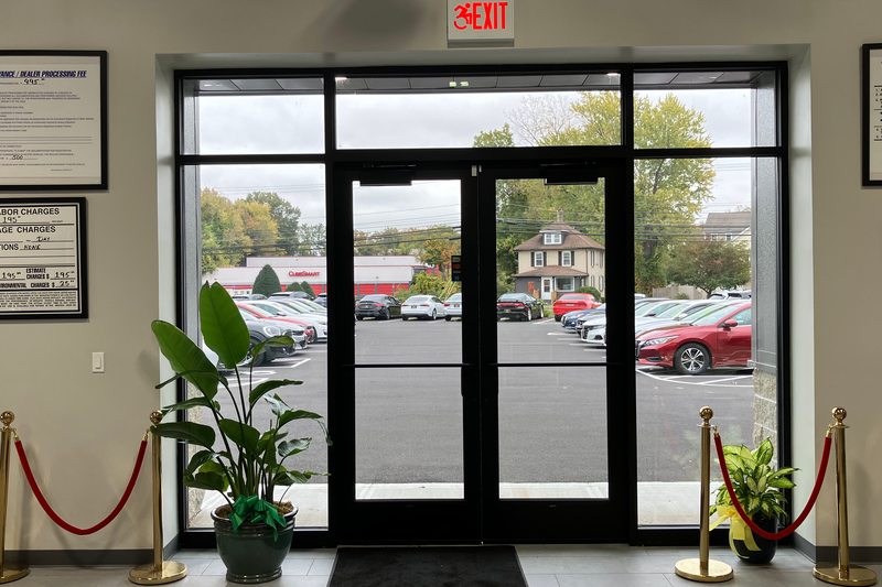 The black-framed doors and tall windows inside Levant Motors