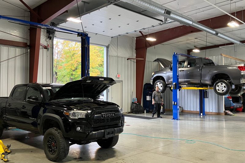 Trucks inside the vehicle service bays