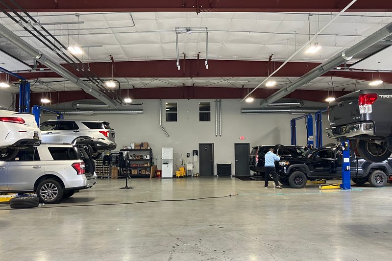 Vehicle lifts and service bays inside the real Levant Motors automotive workshop